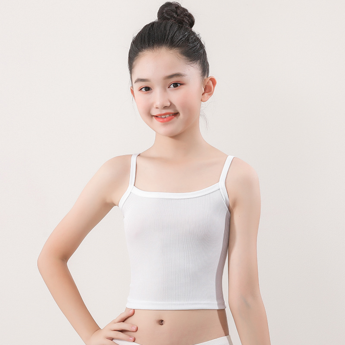 a girl posing wearing kids sportswear white