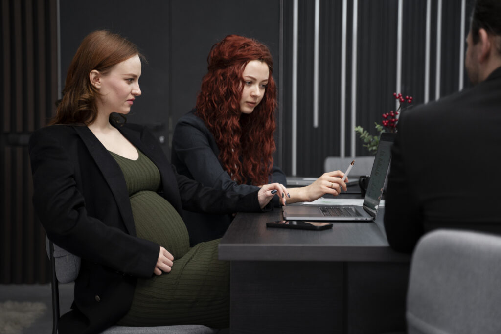 A working pregnant women wearing maternity clothes