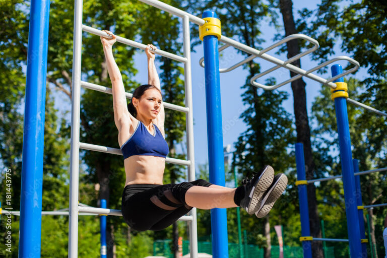 Woman in one of blue seamless sports bras working out at a park.