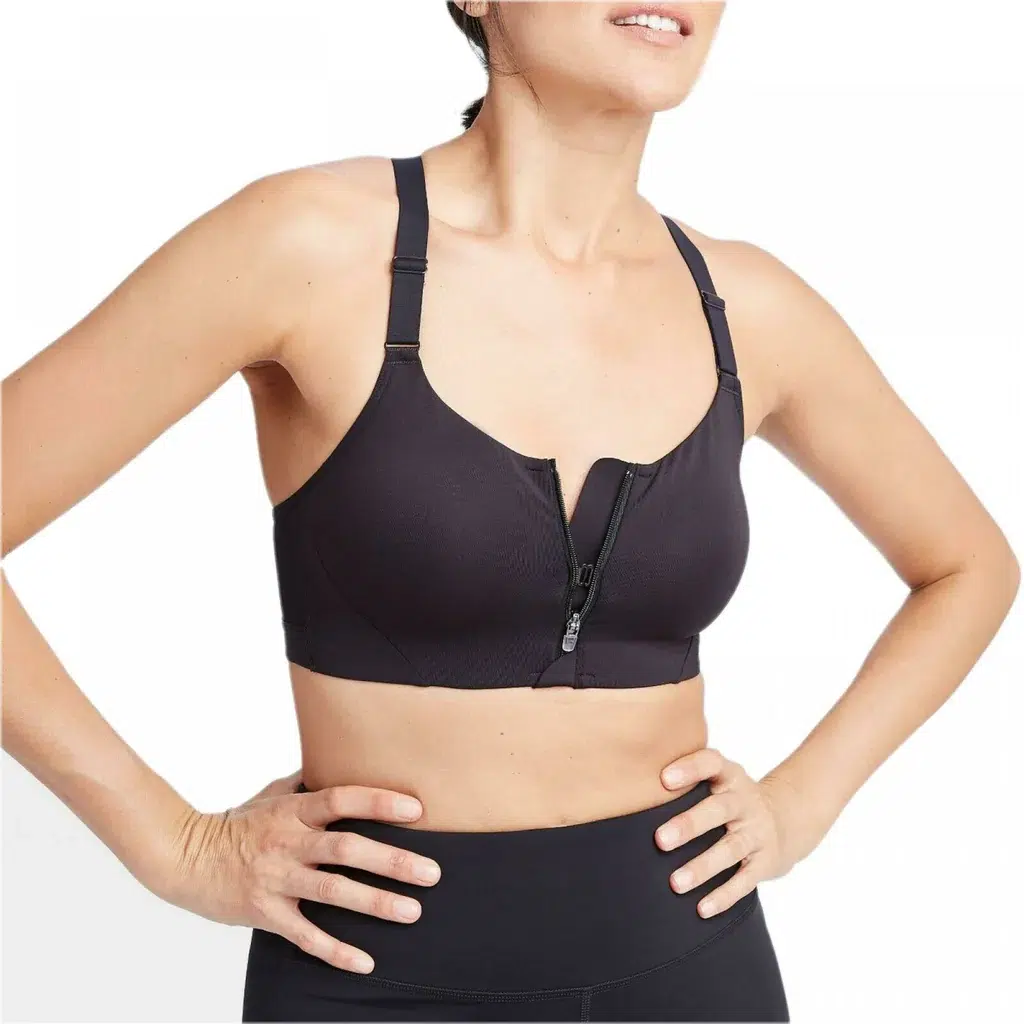 Woman in one of seamless sports bras - all in motion zip front bra