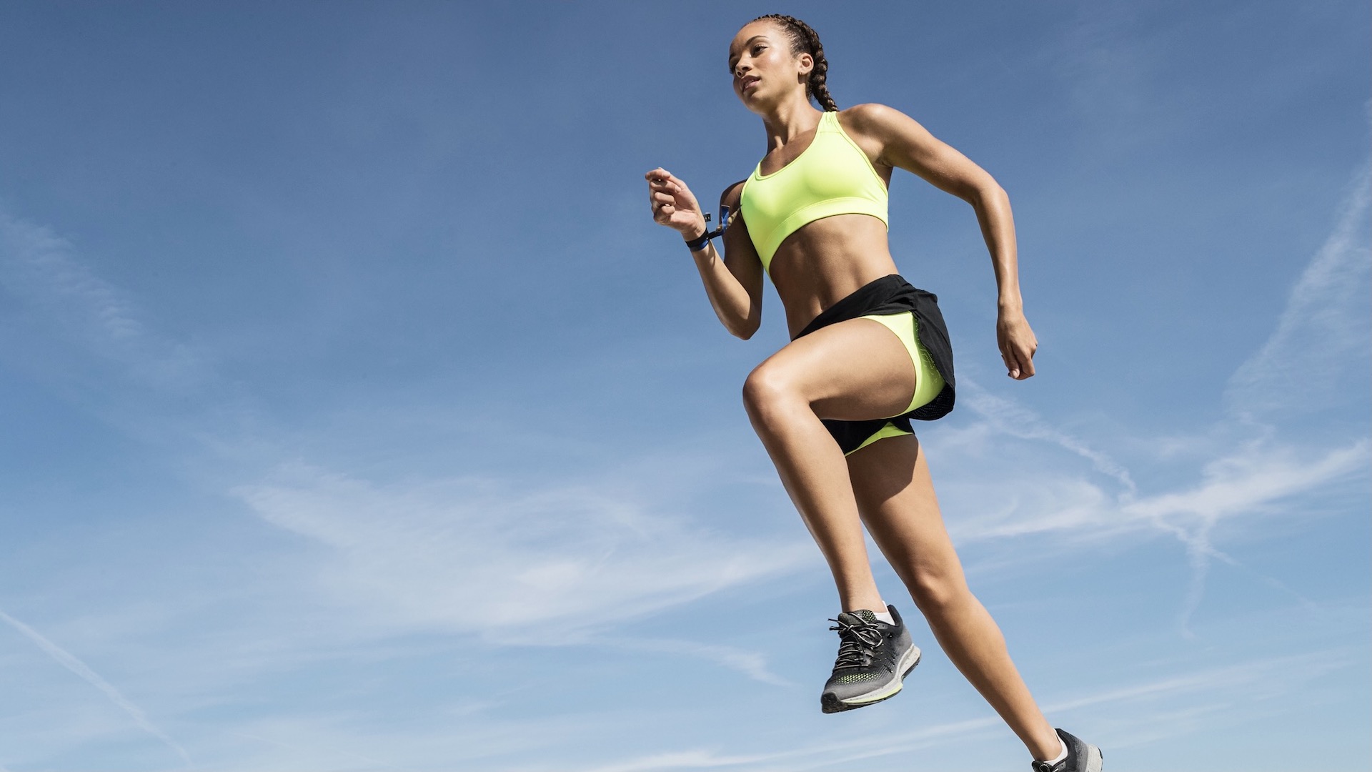 Woman athlete running wearing sports underwear.