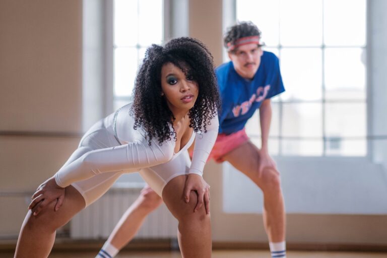 Woman and man embracing workout fashion trends