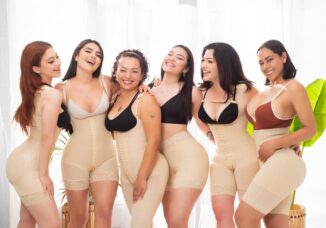 Smiling women of all sizes wearing women's shapewear.